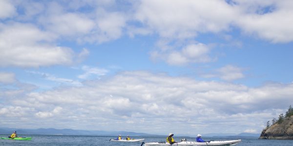 Big blue sky with 3 kayaks
