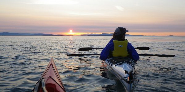 Evening on the water with two kayakers